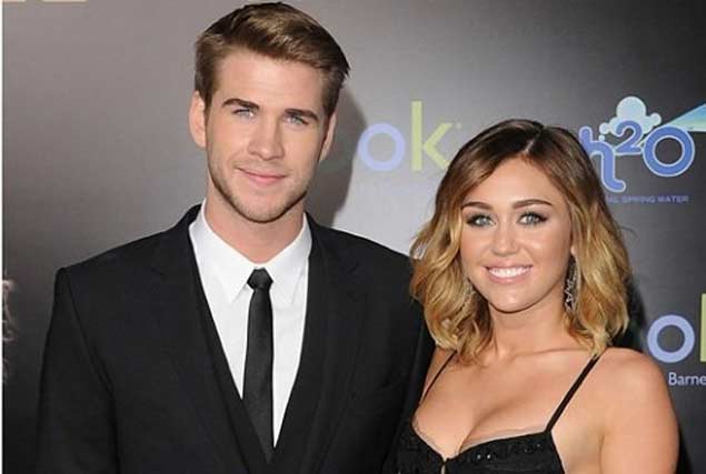 Liam Hemsworth en fiesta con otra mujer